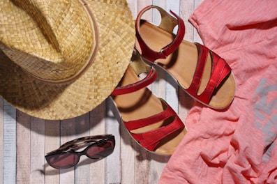 Close-up of tropical accessories like straw hats and sunglasses