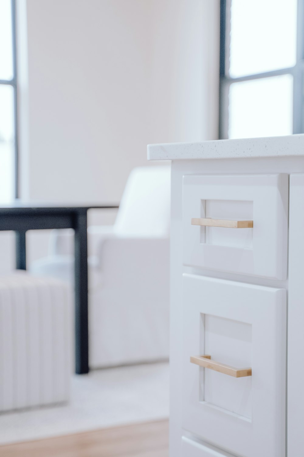 a close up of a drawer on a white cabinet