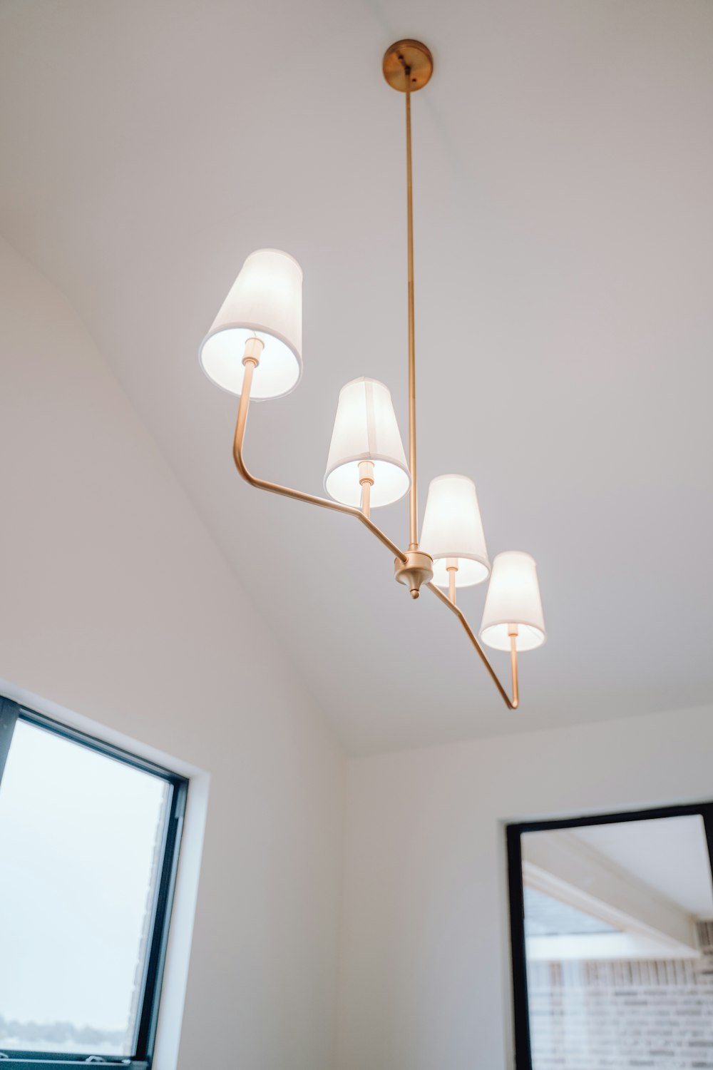 a chandelier hanging from a ceiling in a room