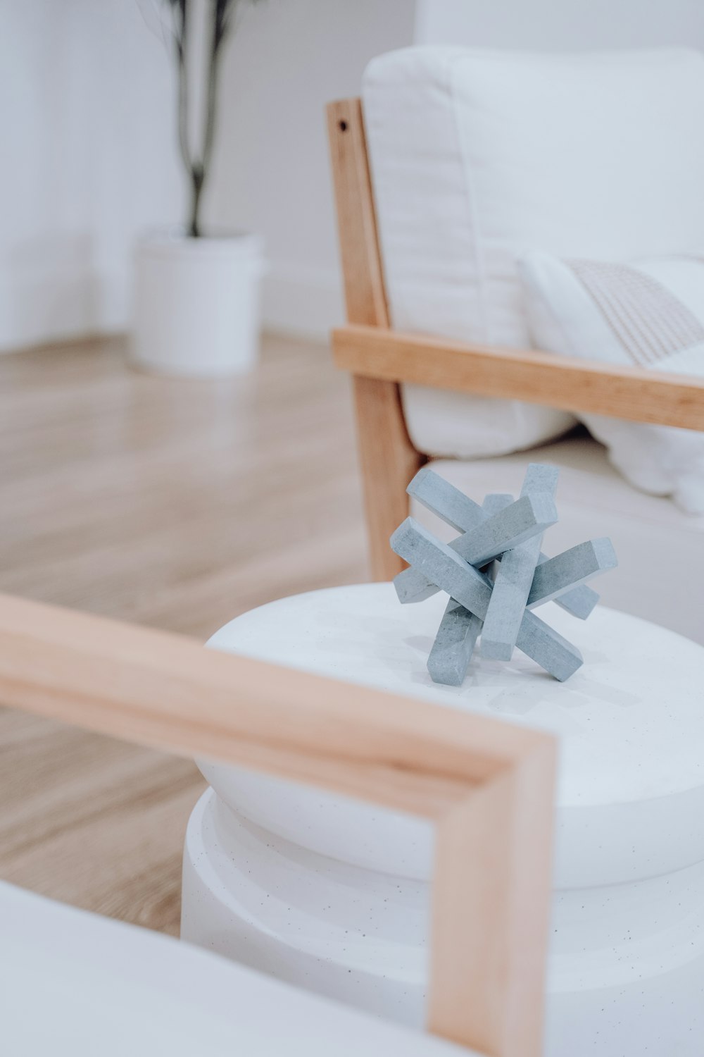 a white bed sitting next to a wooden frame