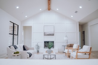 a cleaned living room filled with furniture and a fire place