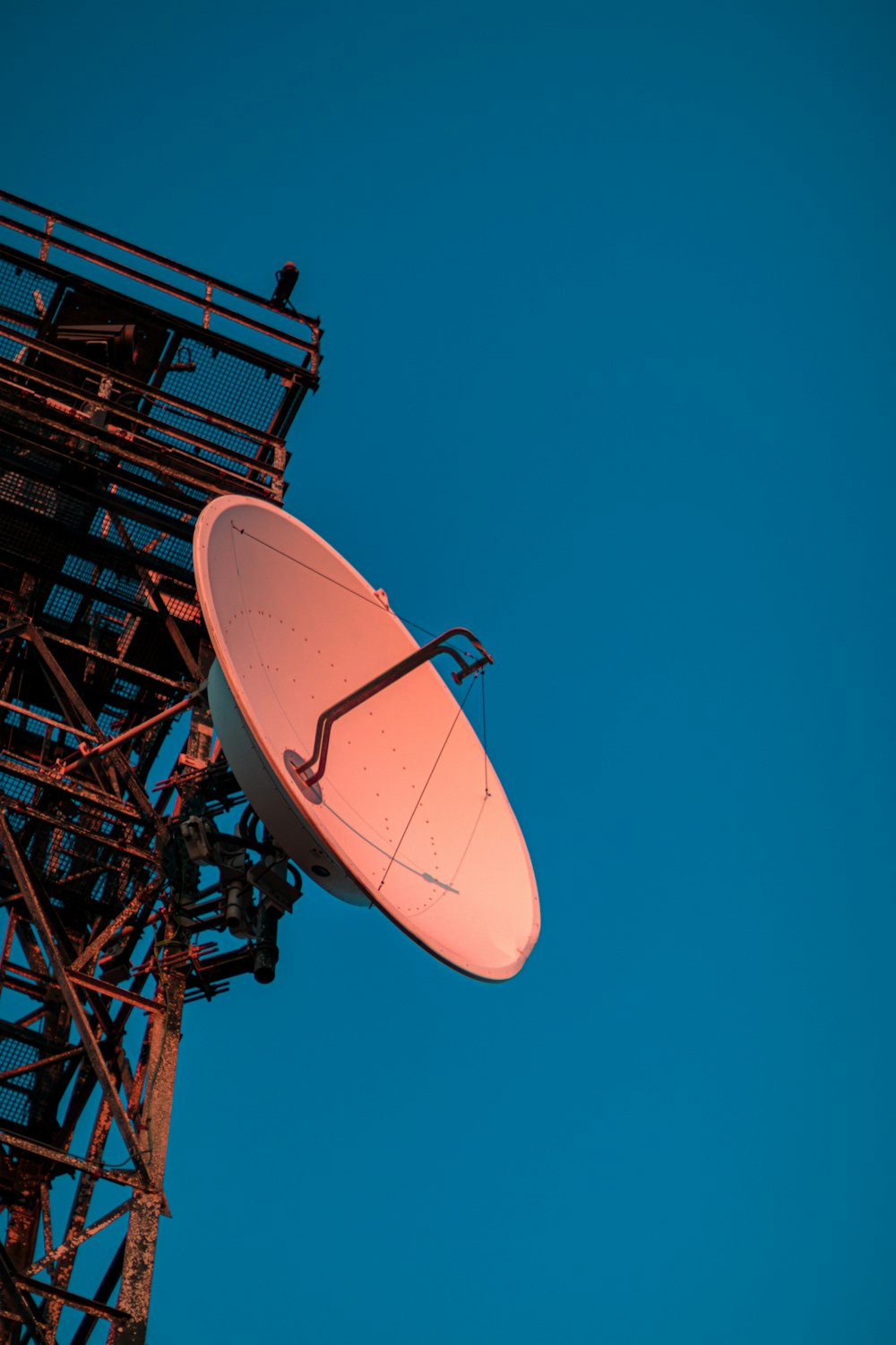 a satellite dish sitting on top of a tower