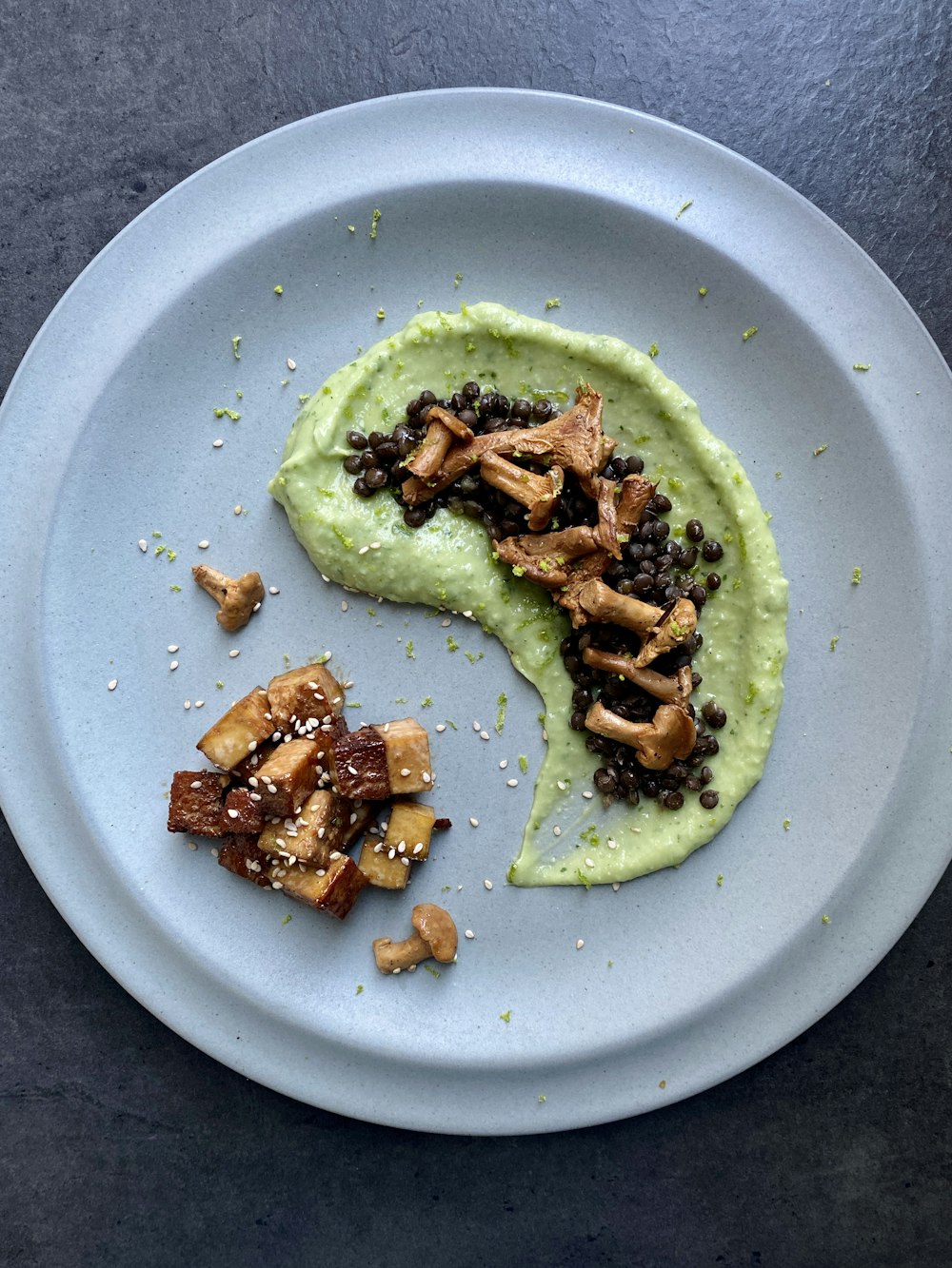 a white plate topped with food on top of a table