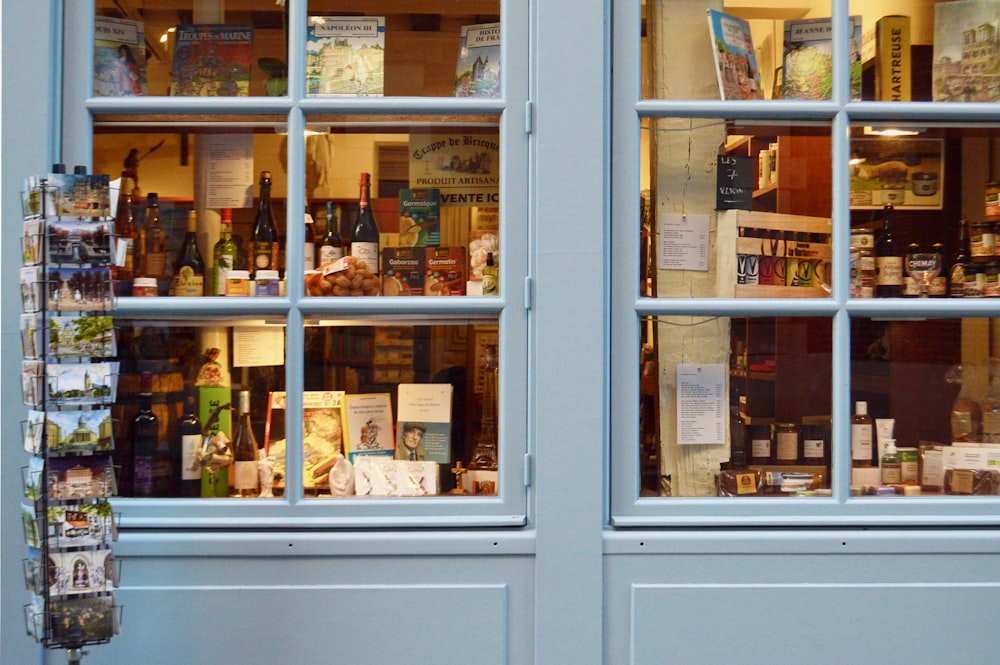 a store front with a lot of bottles in the window