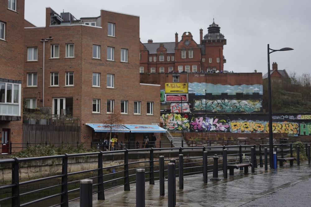 a train station with graffiti on the side of it