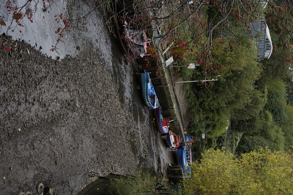 a group of boats sitting on top of a river