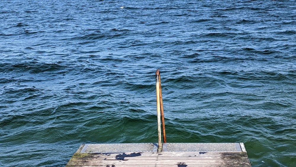 a wooden dock sitting on top of a body of water