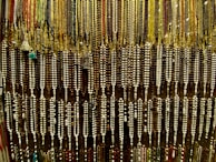 A vibrant display of various bead colors and shapes in natural light.