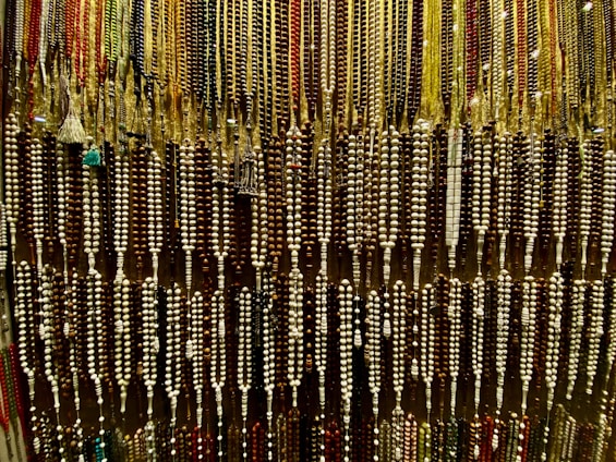 a display of beads and necklaces in a store