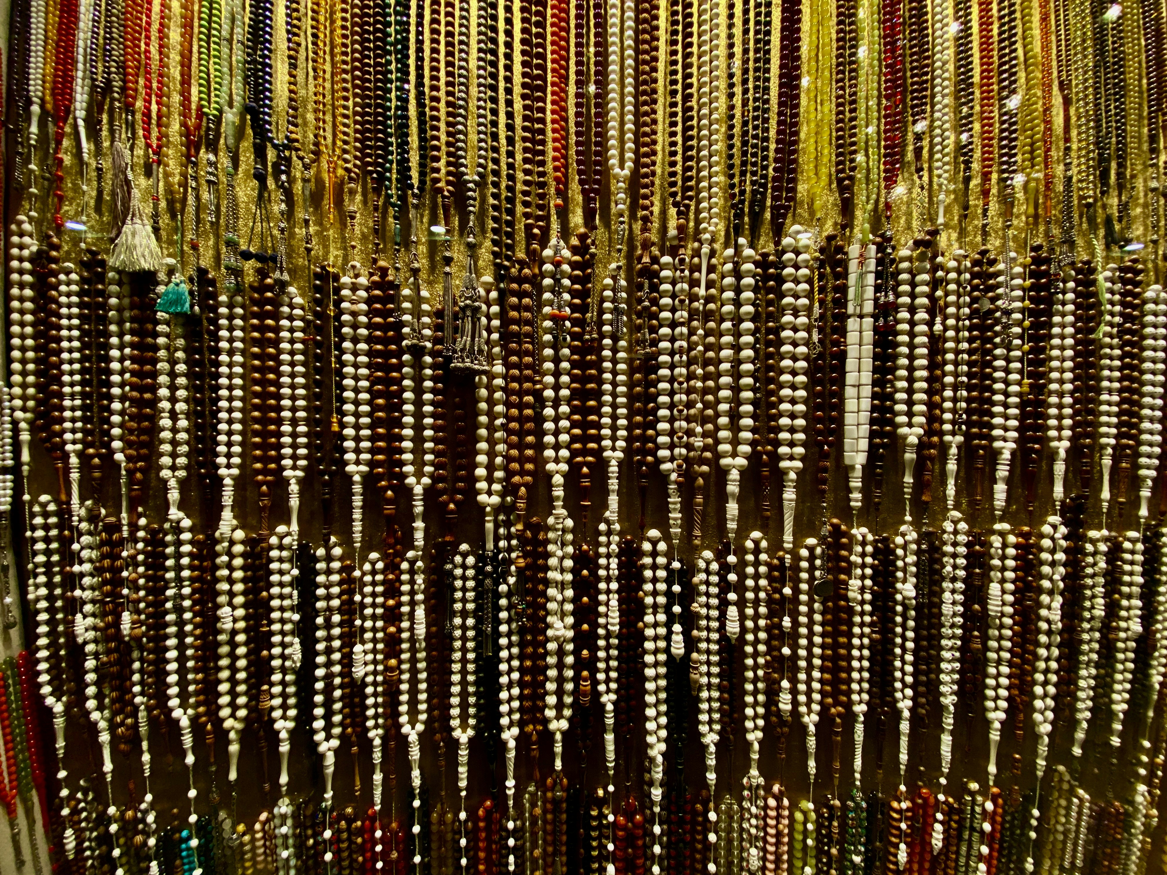 a display of beads and necklaces in a store
