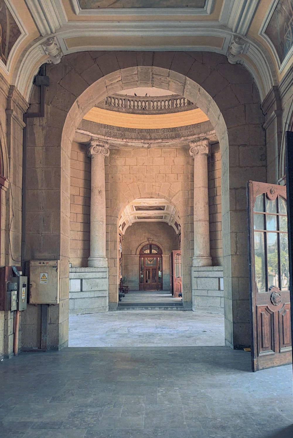 a large hallway with a clock on the wall