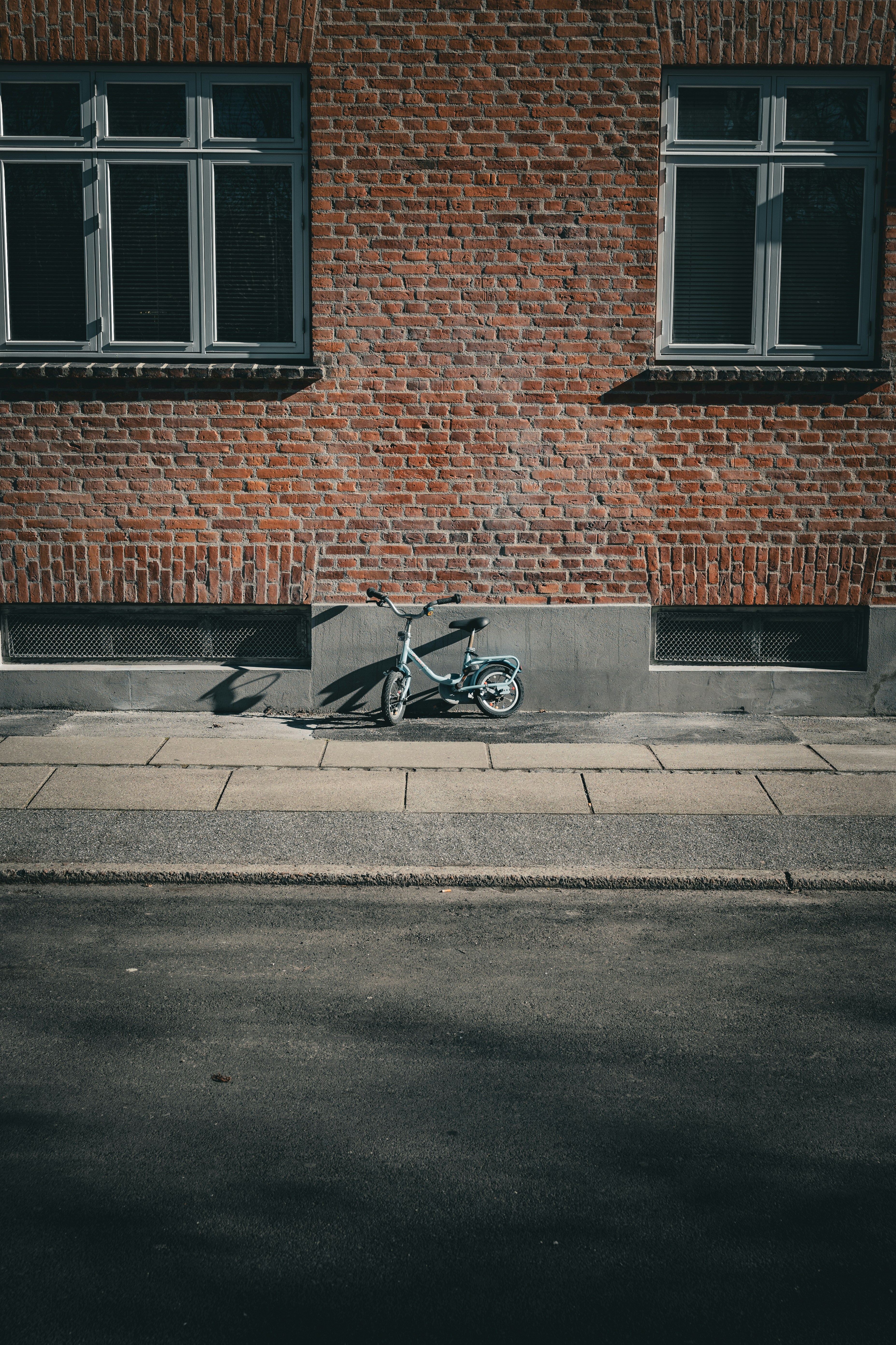 a bicycle parked on the side of a street