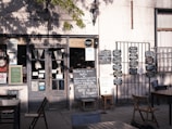 A rustic wooden sign displaying the daily changing menu outside the restaurant.