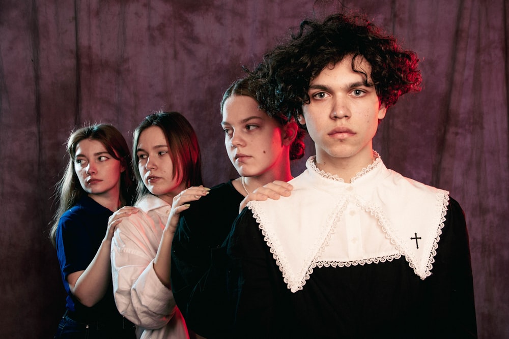 a group of women standing next to each other