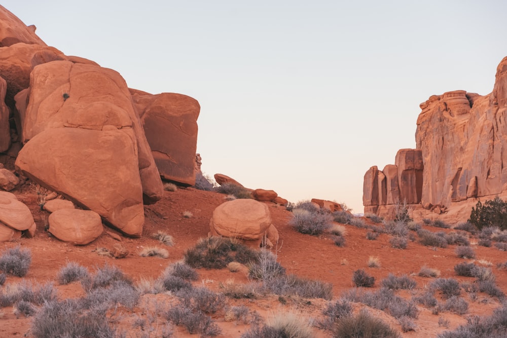 a large rock formation in the middle of a desert