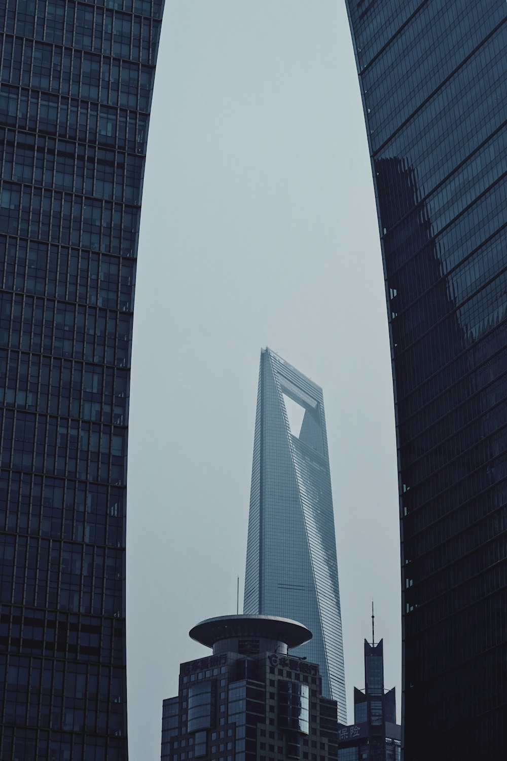 a very tall building towering over a city