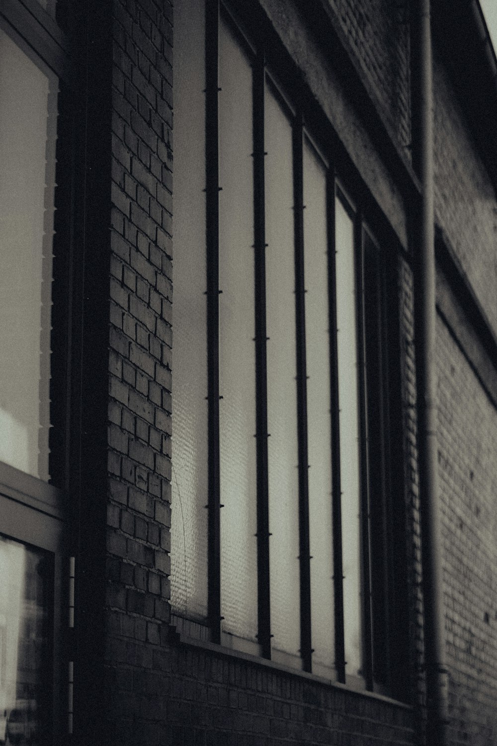 a black and white photo of a brick building