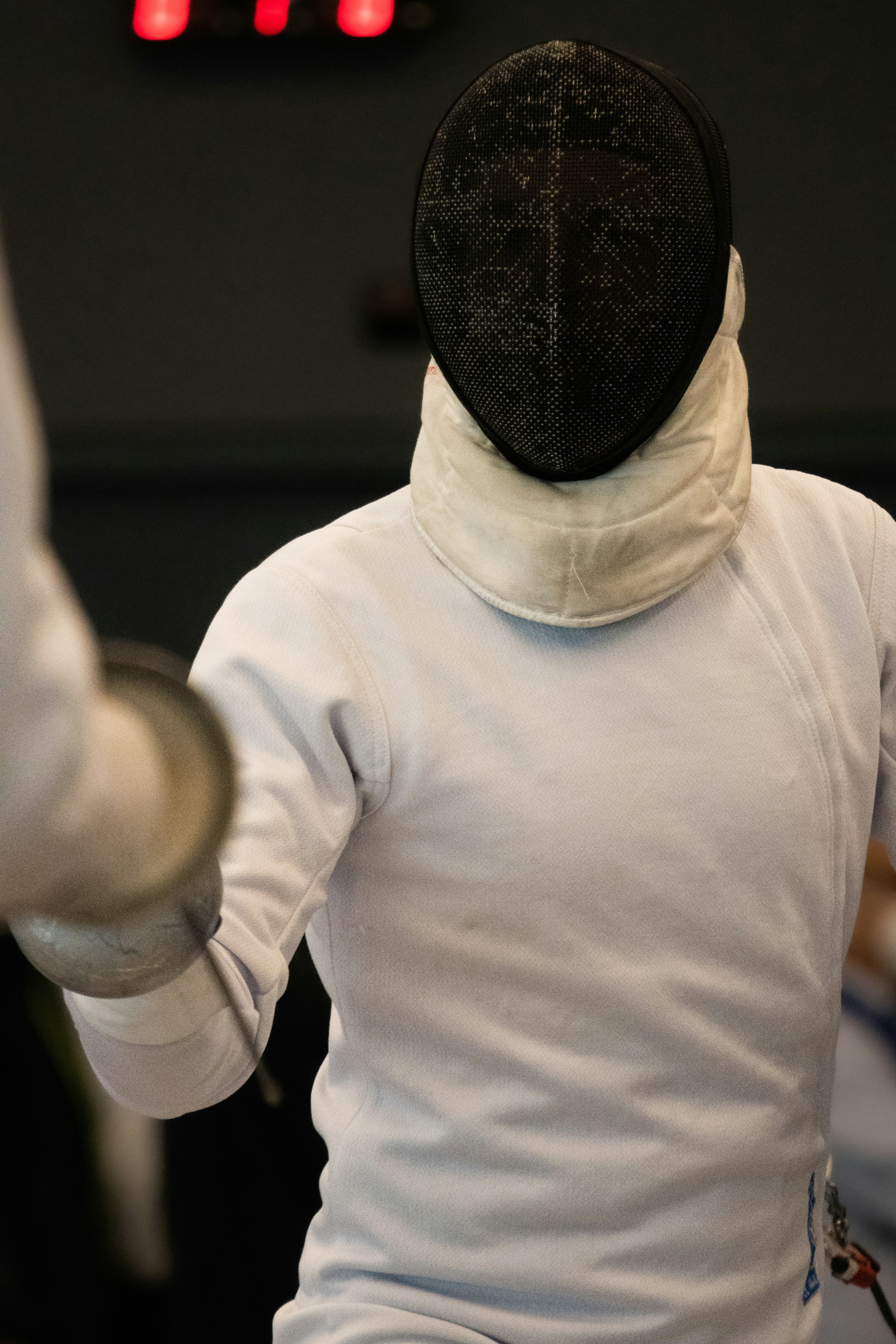 a person in a white shirt and a black hat