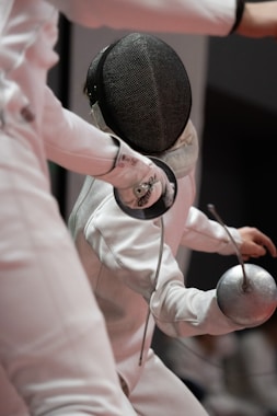 a person in a white suit and a person in a black hat