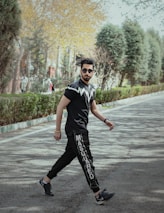 An urban setting featuring a person confidently walking in gravv apparel, blending fitness with everyday life.