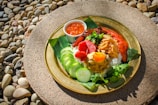 A vibrant dish of traditional Sundanese food beautifully presented.