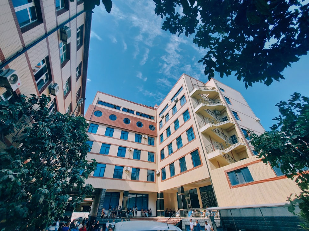 a car parked in front of a tall building