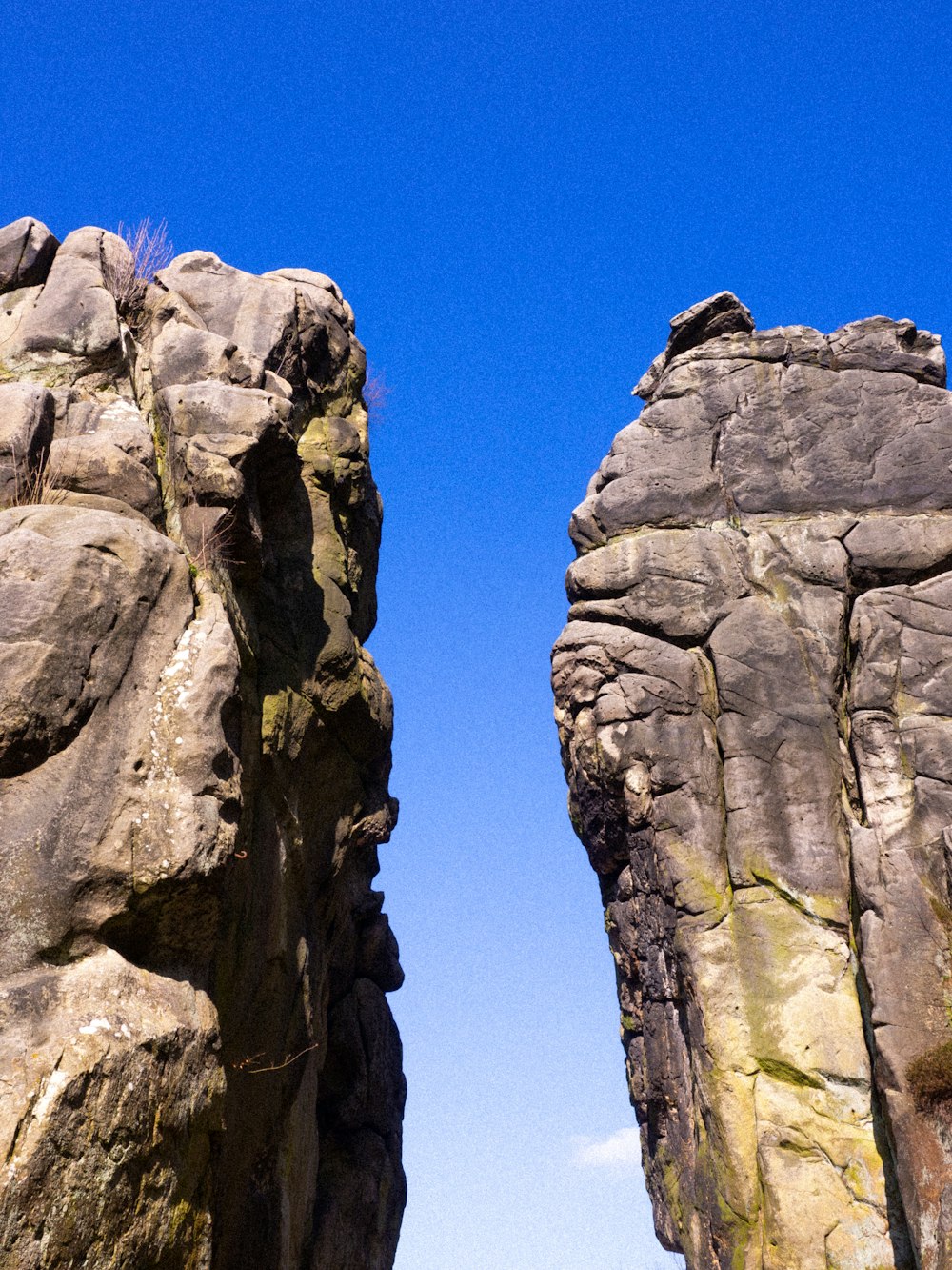 a couple of large rocks sitting next to each other