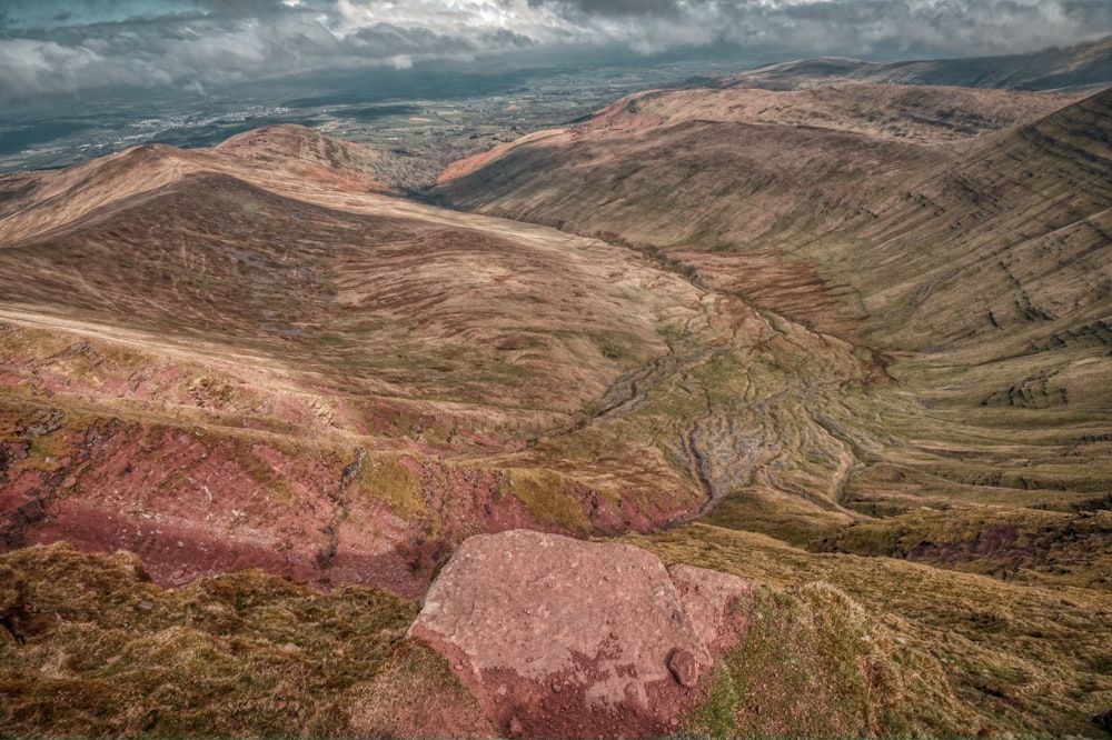 a view of a mountain range with a cloudy sky