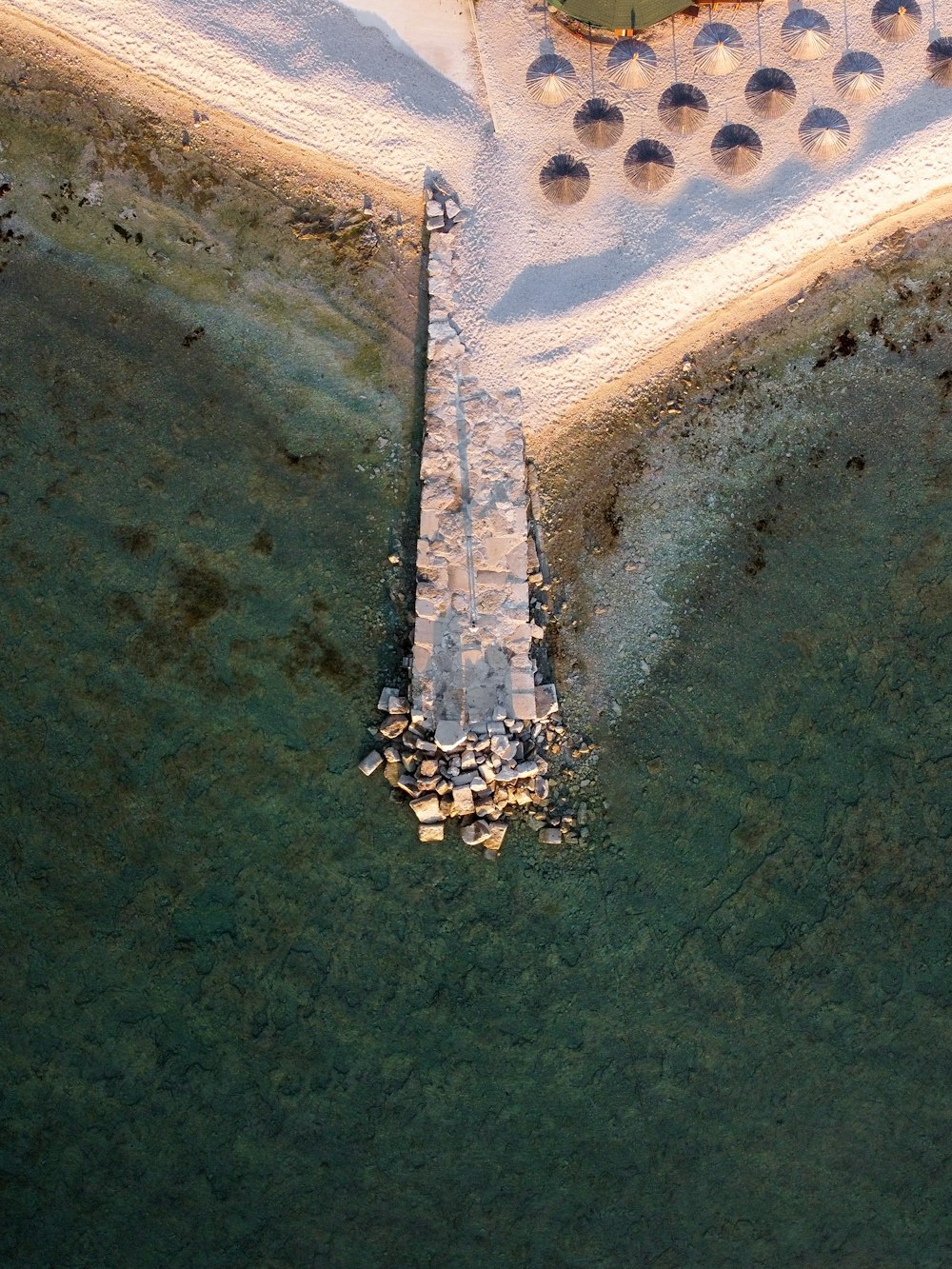 an aerial view of a snow covered beach