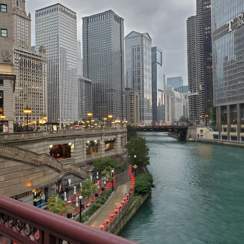 a river running through a city next to tall buildings