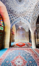 a large area with a rug and a window