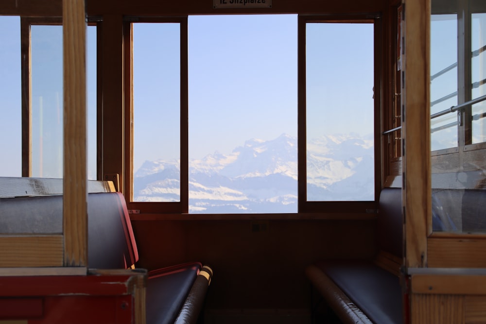 a train car with a view of the mountains