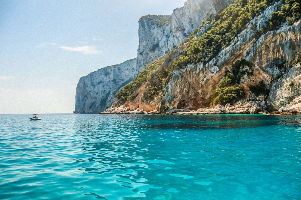 a body of water with a boat in the middle of it