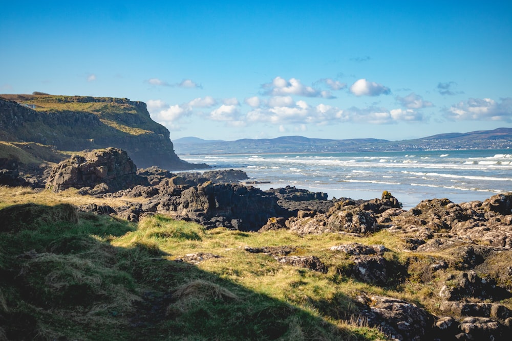 a view of the ocean from a rocky cliff