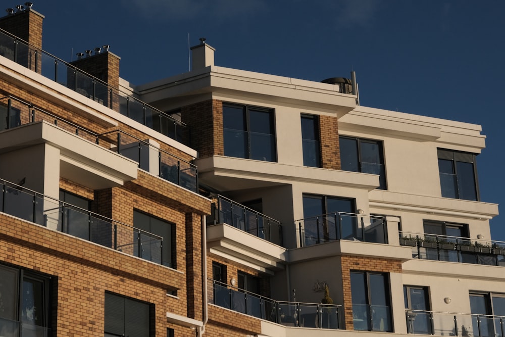 a tall brick building with balconies and balconies