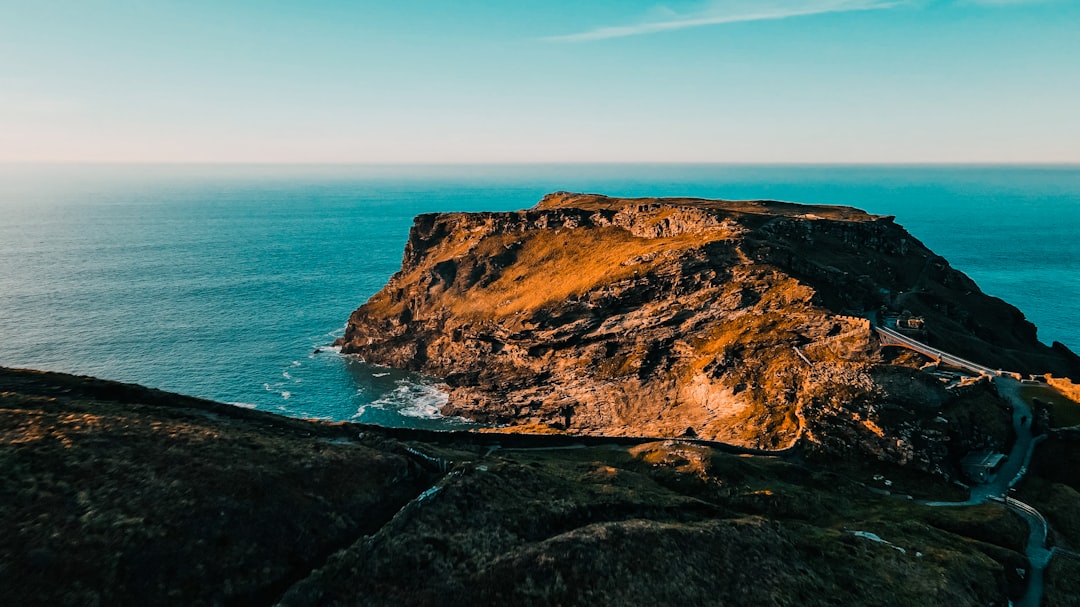 a scenic view of the ocean and a road, Flying landscape of the Atlantic Ocean Aerial view.