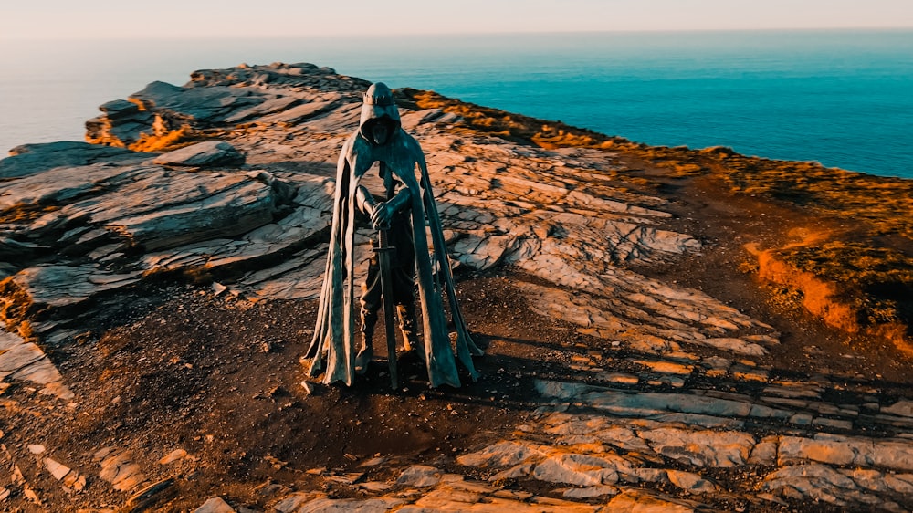 a piece of wood sitting on top of a rocky cliff