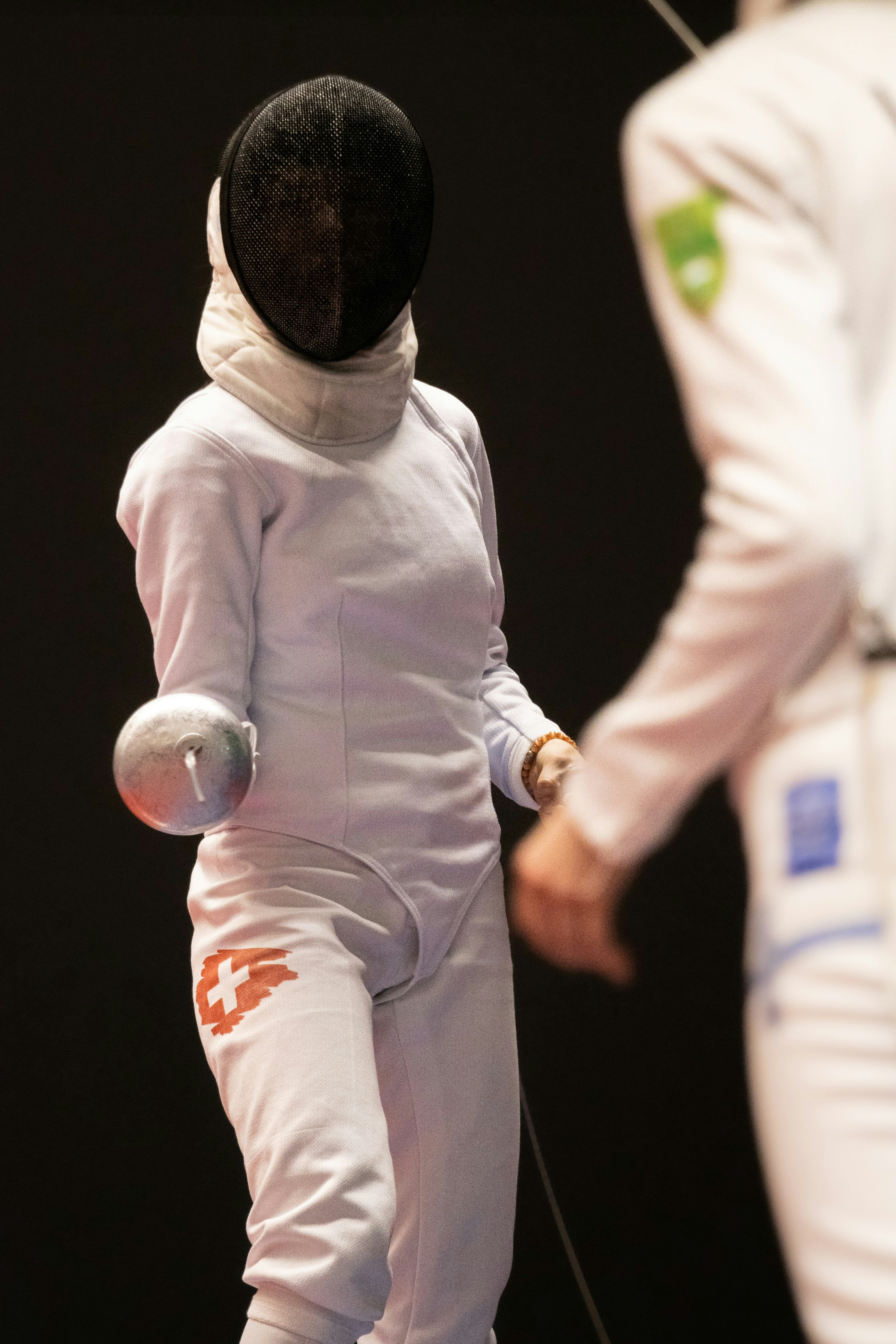 a person in a white suit and a person in a white suit