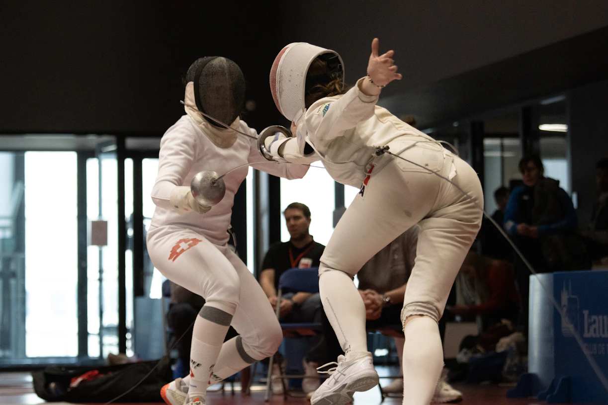 a couple of people that are standing in a court