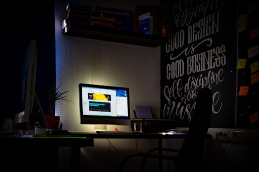 a computer monitor sitting on top of a desk