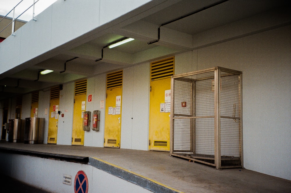 a row of yellow doors sitting next to each other