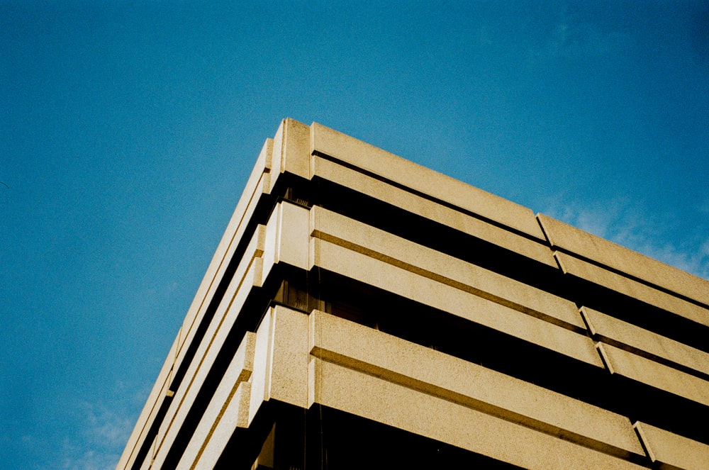 a clock on the side of a tall building