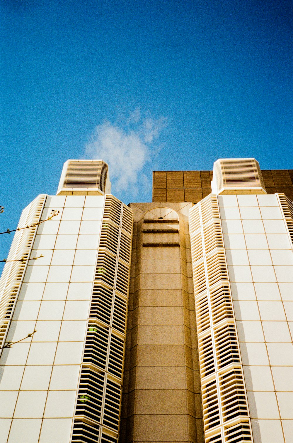 a tall building with a clock on the front of it