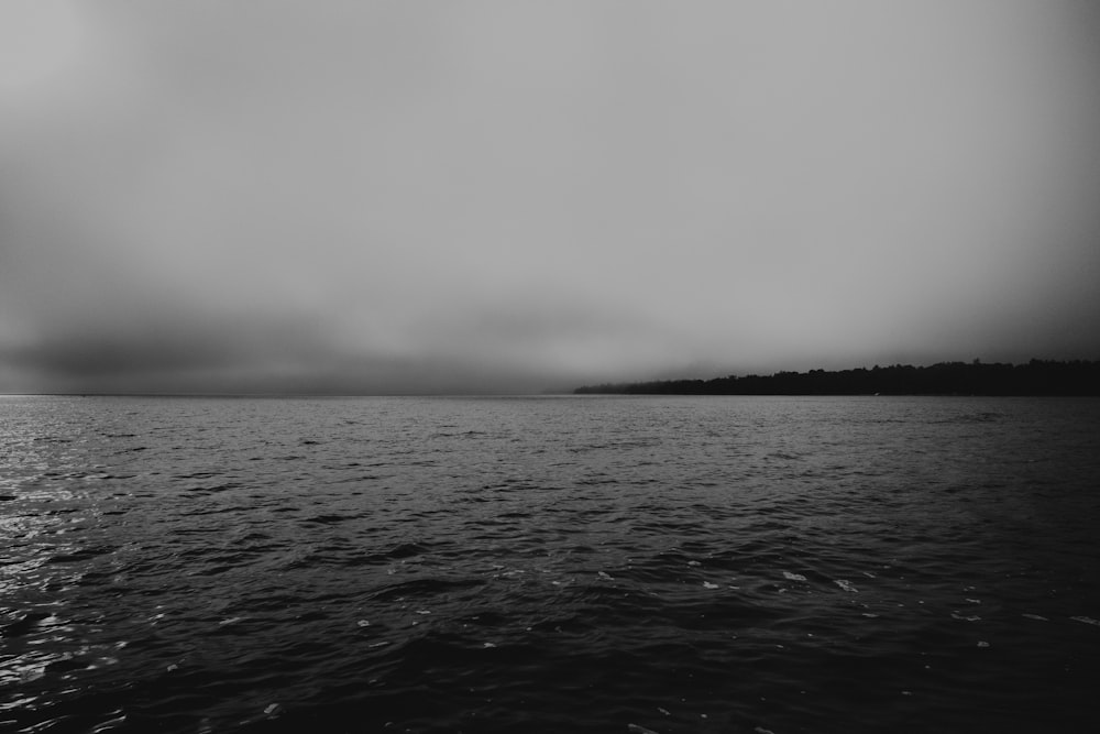 a black and white photo of a body of water