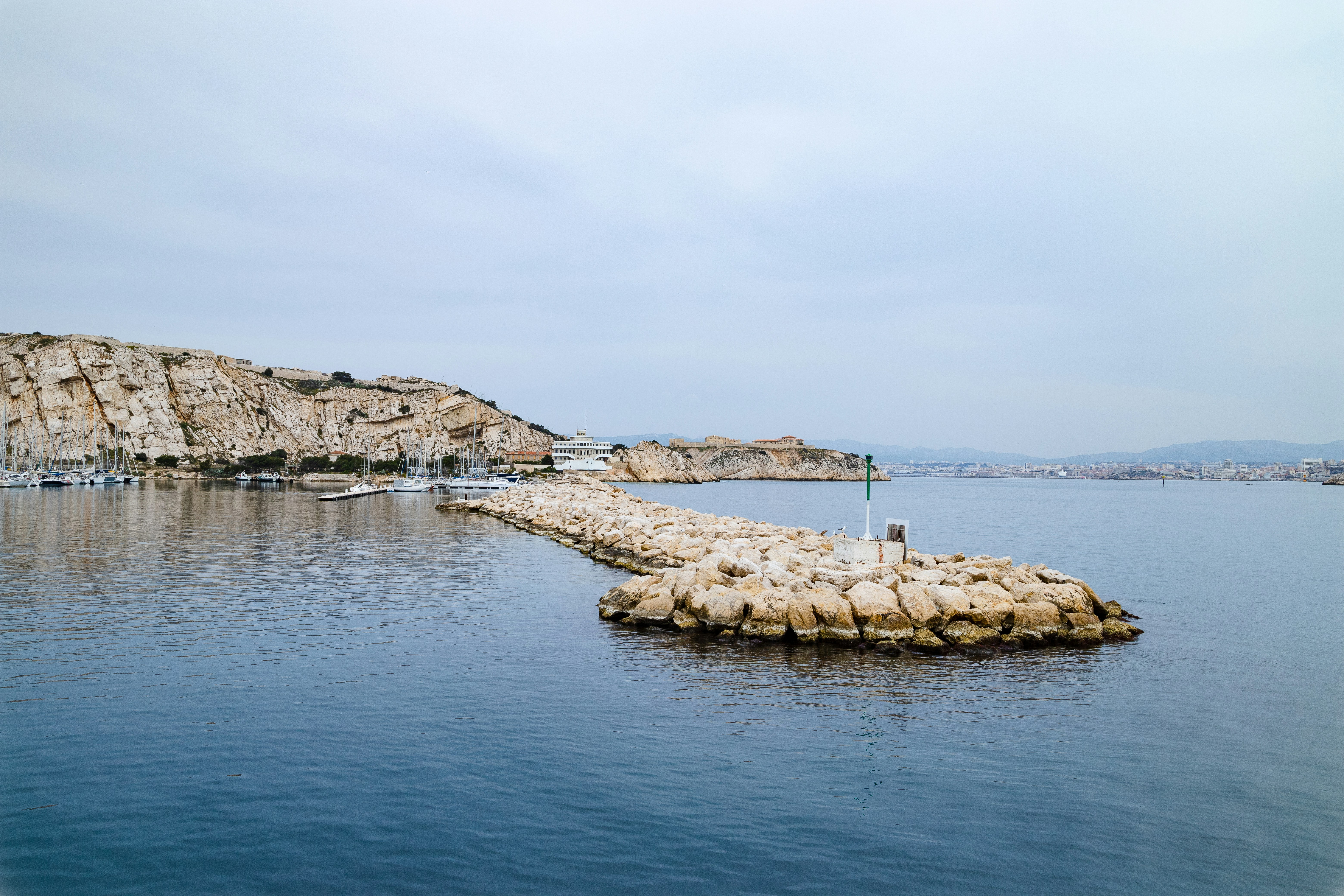 a long dock in the middle of a body of water