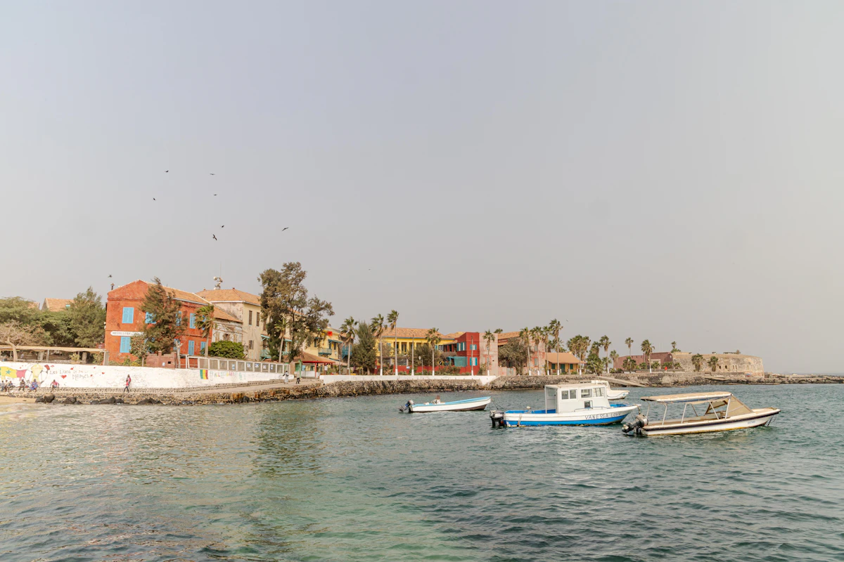 Salt harvesters wading through the pink waters of Lac Rose near Dakar at first light