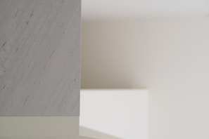 Interior space featuring a marble countertop with soft lighting highlighting its smooth surface