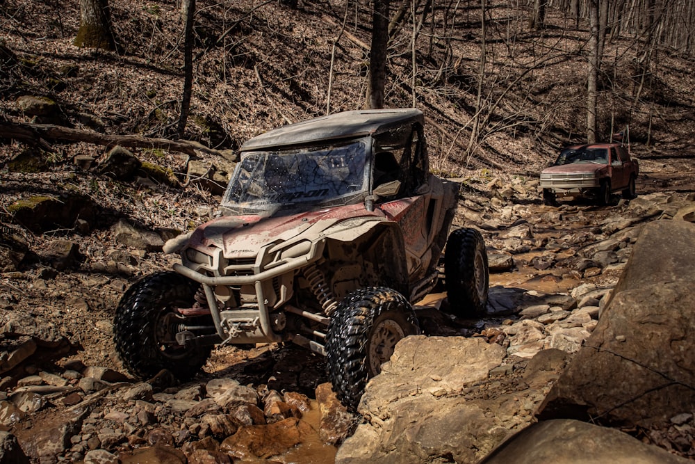 an off road vehicle driving on a rocky trail