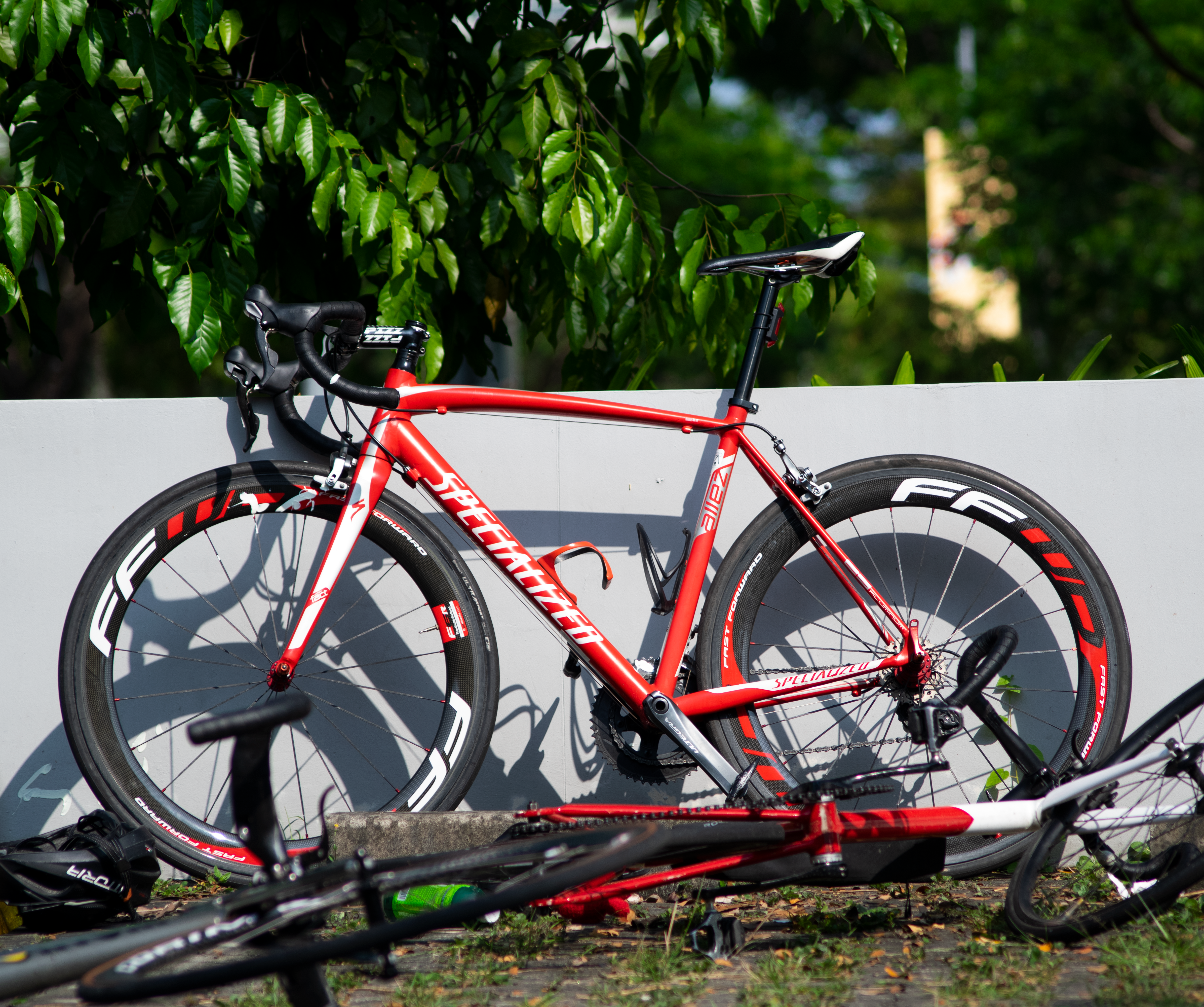 Road bicycle leaning against a wall in warm light