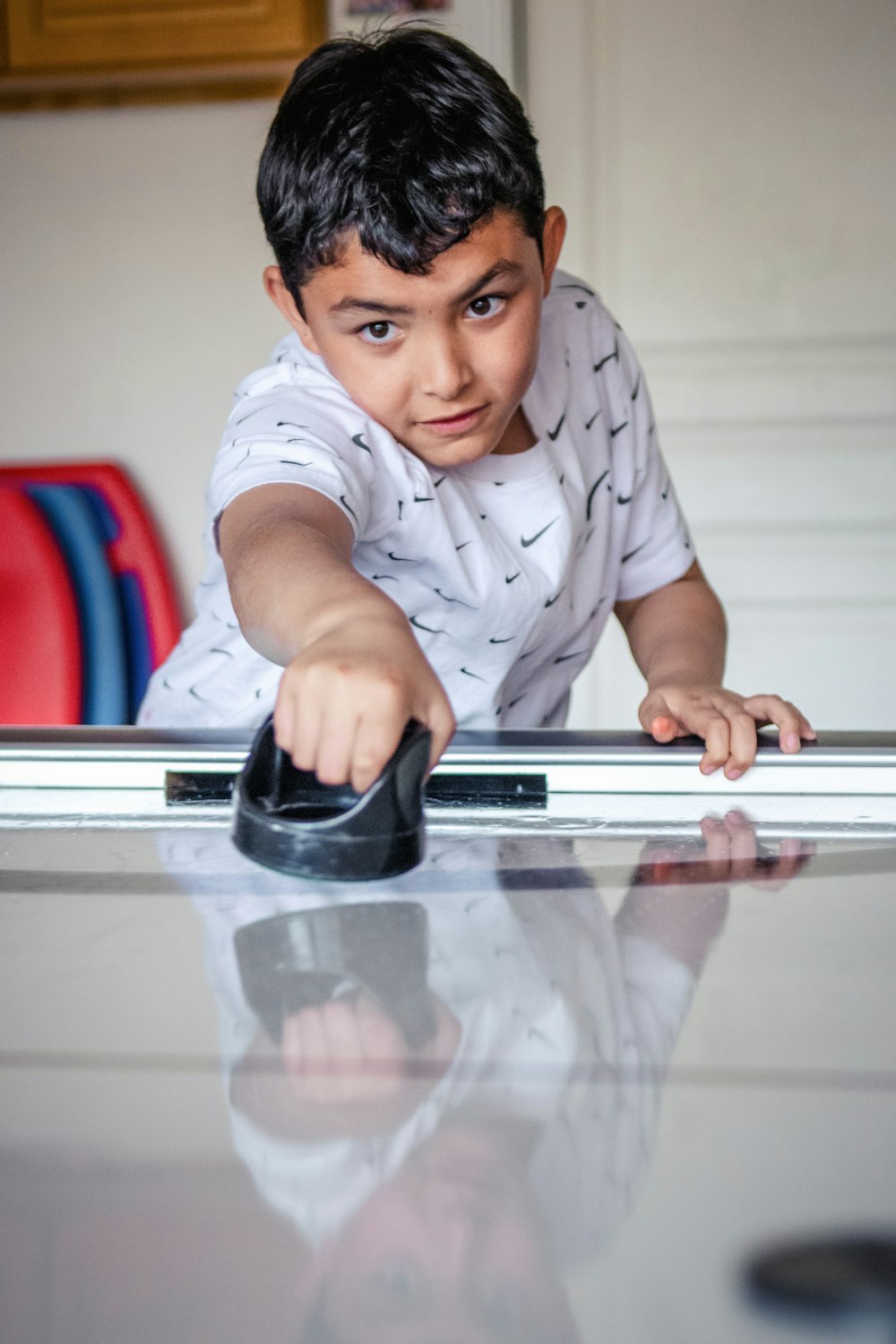 a little boy that is standing on a table